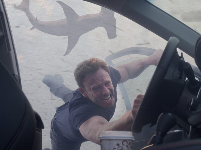 In this image released by Syfy, Ian Ziering portrays Fin Shepard in a scene from "Sharknado 3: Oh Hell No!" premiering Wednesday, at 9 p.m. EDT on Syfy.