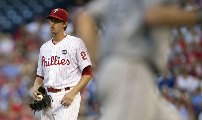 Phillies starting pitcher Aaron Nola watches as Tampa Bay's Nathan Karns rounds the bases after hitting a solo home run during the third inning Tuesday in Philadelphia.