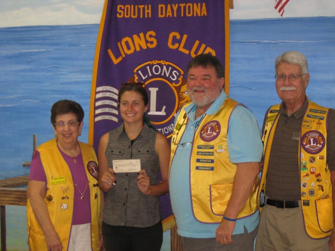 The 2015 Ride for Sight Memorial Scholarship was awarded to Kaelin Darcy, center left, by the South Daytona Lions Club at a recent meeting. King Lion Ted Evens, center right, presented the $1,000 award along with Lion scholarship chairpersons Sandy Garofalo, left, and Richard Boyd, right. Darcy is a 2015 graduate of Atlantic High School and will attend the University of North Florida in the fall.