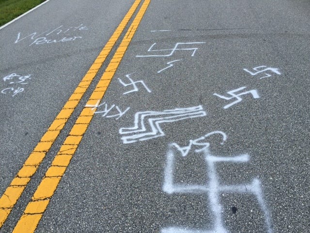 Flagler County sheriff's deputies found racial slurs and offensive symbols spray-painted on the pavement along Lakeview Boulevard just south of Laramie Drive in Palm Coast on Friday. Photo provided by Flagler County Sheriff's Office.