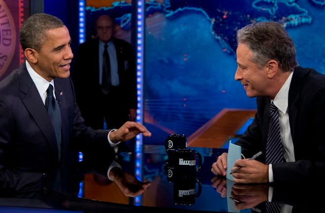 In this Oct. 18, 2012 file photo, President Barack Obama talks with Jon Stewart during a taping of his appearance on "The Daily Show with John Stewart", in New York. Stewart enters the home stretch of his 16 years on Comedy Central's "The Daily Show" on Monday, July 20, 2015, with 12 more nights of jokes at the expense of those who make and report the news before he signs off for good on Aug. 6, 2015. (AP Photo/Carolyn Kaster, File)