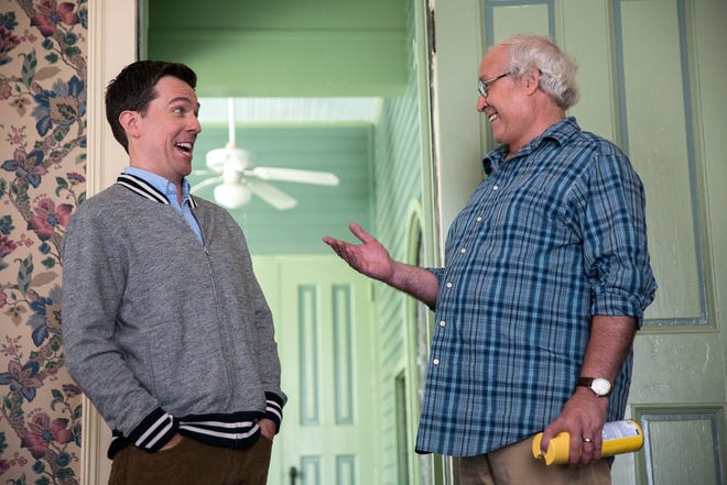 Rusty and Clark Griswold (Ed Helms and Chevy Chase) share a laugh in “Vacation.”