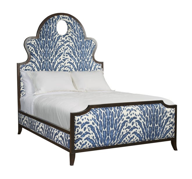 Indigo still is popular in home design, and teamed with white, this animal print is engaging on an upholstered bed called Denise, designed by Kristin Drohan.