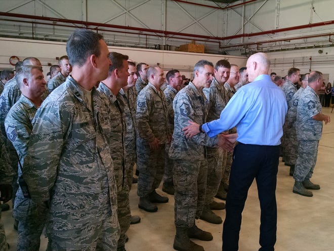 Gov. Rick Scott shakes hands with members of the 125th Fighter Wing in a hangar at their base near the Jacksonville International Airport on Wednesday, July 22, 2015. Scott was addressing the Air Guardsmen about steps he was taking to address security concerns following the murder of four marines and a sailor in Chattanooga, Tenn. on Thursday.