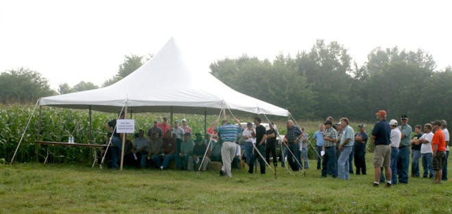 Participants in last year's Lenawee Conservation District Field Day listen to a presentation. COURTESY PHOTO