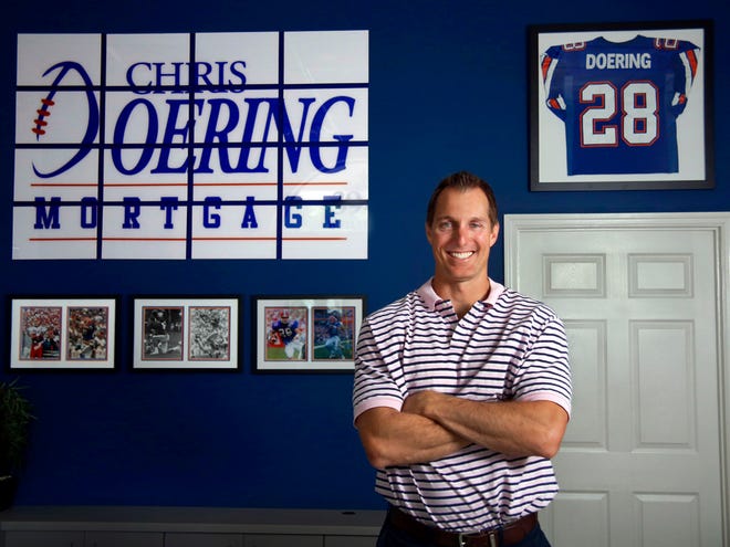 Former Florida Gators football player Chris Doering is shown in the lobby of Chris Doering Mortgage in Gainesville in this May 12, 2015 file photo.