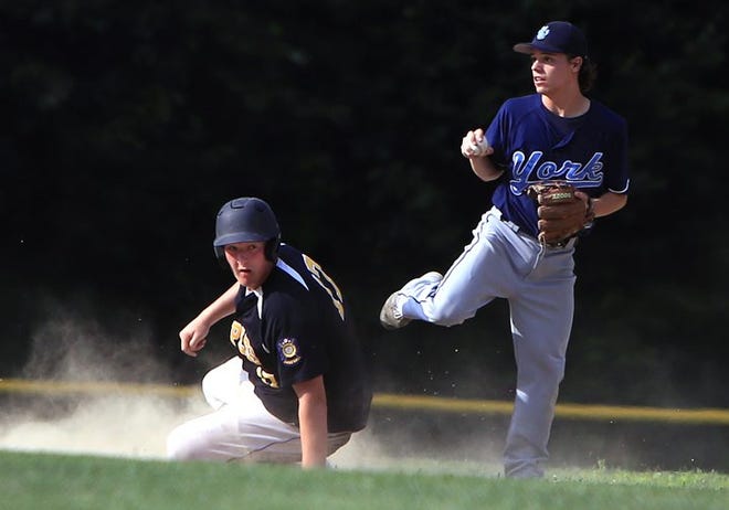 Eliot Post 188 baserunner Jake Lebel slides into second base after being forced out by York shortstop Ian Hovde, right, during Tuesday's American Legion Zone 4 semifinal game in South Berwick, Maine. Ioanna Raptis/Seacoastonline