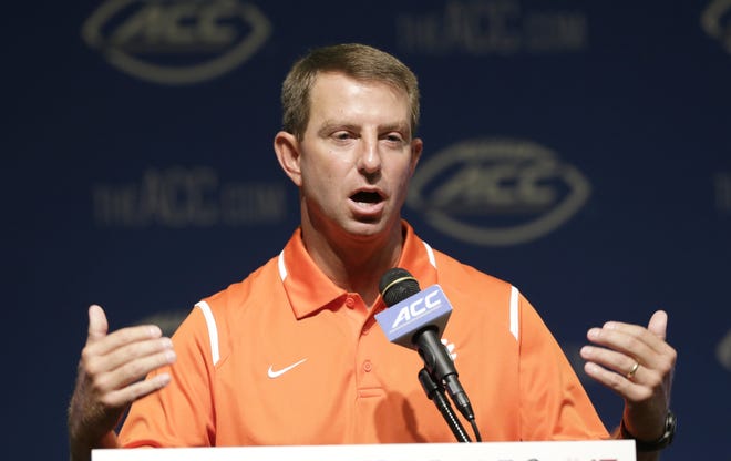 Clemson coach Dabo Swinney responds to questions during the ACC NCAA football kickoff in Pinehurst, N.C., Tuesday. (AP Photo/Gerry Broome)