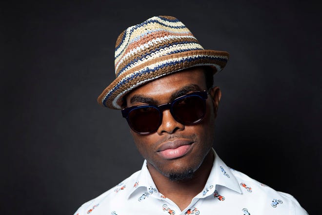In this Tuesday, July 21, 2015 photo, Jamaican singer OMI poses for a portrait during an interview in Los Angeles. OMI may seem like an overnight success, but his chart-topping summer hit "Cheerleader" has been years in the making. The upbeat, ode to a supportive girlfriend recently rallied to No. 1 on Billboard's Hot 100 chart following huge success abroad. (Photo by Rebecca Cabage/Invision/AP)