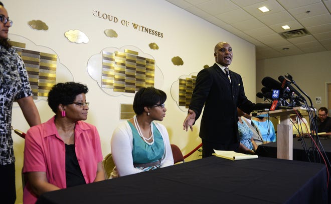 Cannon Lambert Sr. the attorney for the family of Sandra Bland addresses the media during a news conference at Dupage African Methodist Episcopal Church on Wednesday, July 22, 2015, in Lisle, Ill. Bland was arrested and taken to the Waller County jail, about 60 miles (100 kilometers) northwest of Houston on July 10 and found dead July 13. Officials say Bland hanged herself with a plastic garbage bag in her jail cell, a contention her family and supporters dispute. (AP Photo/Matt Marton)