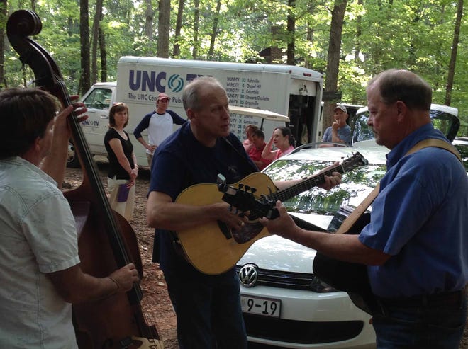 Reese Combs, Larry Keith and Paul Eaton of The Lonesome Road Band were filmed by UNC-TV crews in June to spotlight a song Keith wrote about his wife Denna's grandmother, Virginia Dare Johnson.