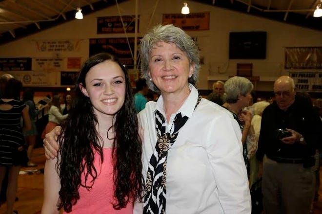 Hanna Riedle, left, stands by Barb Maske, a member of the Lincoln Zonta Club at the Mount Pulaski High School Honors Night. Photo submitted.