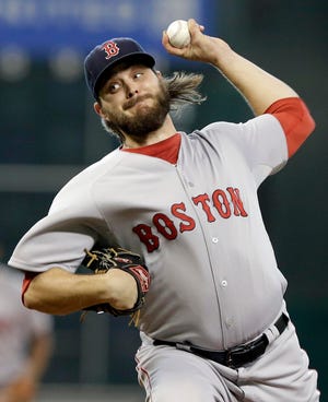 Boston Red Sox pitcher Wade Miley delivers against the Houston Astros during their game Thursday in Houston. The Astros led, 4-3, in the eighth inning when the Herald went to press. Photo by AP