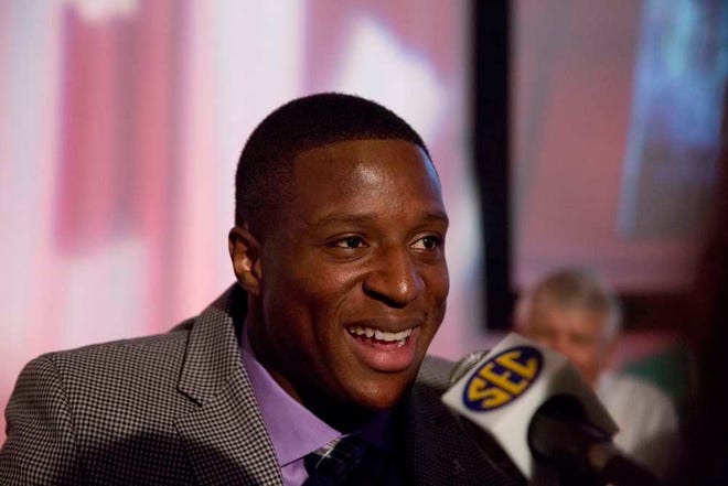 Alabama's Kenyan Drake speaks to the media at SEC football media days on Wednesday in Hoover, Ala. (AP Photo/Brynn Anderson)