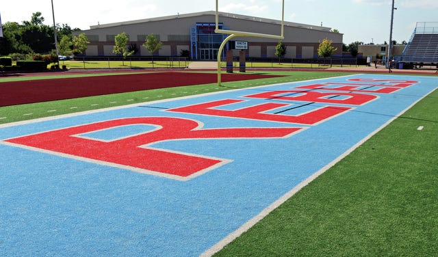 TIMES RECORD FILE PHOTO    An end zone on the football field at Southside High School's Jim Rowland Stadium showcases the school's Rebel mascot name.