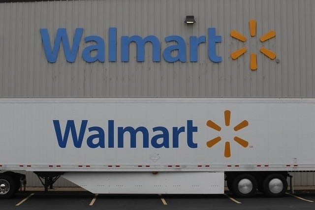 The Wal-Mart company logo is seen outside a Wal-Mart Stores Inc. company distribution center in Bentonville in June 2013. REUTERS File Photo