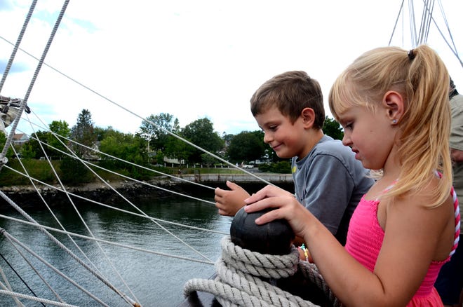 Caden Roberts, 6, of Rochester, and his sister Cailyn, 5, look at the sail riggings aboard the El Galeon Andalucia during the Sail Portsmouth 2015 festival at Fish Pier on Peirce Island on Friday. Photo by Suzanne Laurent