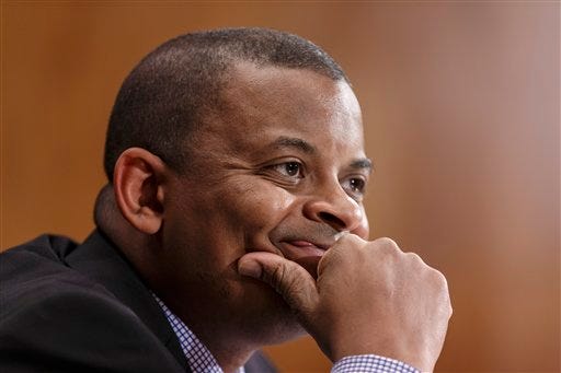 In this March 13, 2014 file photo, Transportation Secretary Anthony Foxx is shown during testimony before the Senate Transportation subcommittee on Capitol Hill in Washington. Foxx says the government has opened a price-gouging investigation involving four airlines that allegedly raised airfares in the Northeast after an Amtrak crash in Philadelphia in May disrupted rail service.