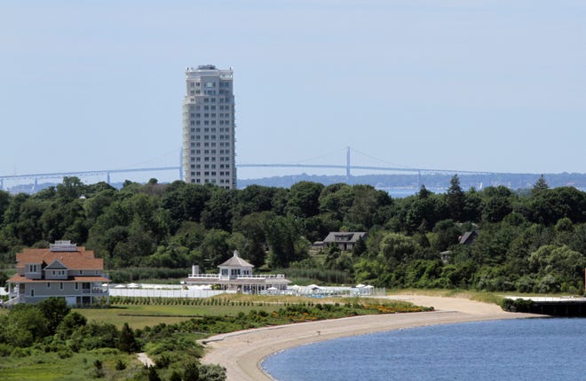 Carnegie Tower, visible from Mount Hope Bridge, has been a financial mess for its developer J. Brian O'Neill, who was forced to turn over 68 unsold luxury units in the building to his creditors. The Providence Journal/Mary Murphy