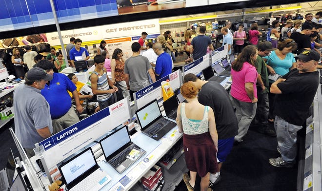 Customers fill the aisles at Dartmouth's Best Buy during the August sales tax holiday in 2012. FILE