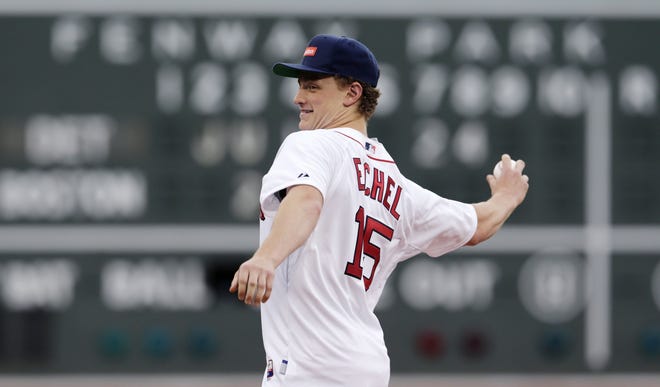 Former Boston University hockey forward Jack Eichel throws out the ceremonial first pitch at Fenway Park. Eichel, who left BU to enter the NHL Draft, was selected in the first round by the Buffalo Sabres last month. The Assoicated Press