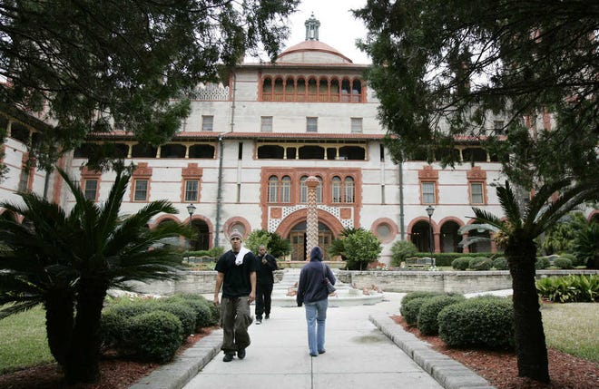 Students walk into the main courtyard of Flagler College, formerly the Ponce De Leon Hotel built 1885-1887, in St. Augustine, Fla. (AP Photo/Amy Sancetta)