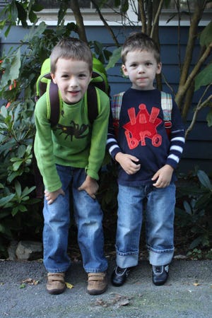 In this 2012 photo provided by Sarah Trainor, who runs SampleSaleMom.com, her sons Alex, 5, and Chase, 3, wear backpacks, shirts and shoes by various brands promoted on the online flash sales Trainor features on her website. The photo was taken on Alex's first day of kindergarten. (Sarah Trainor via AP)