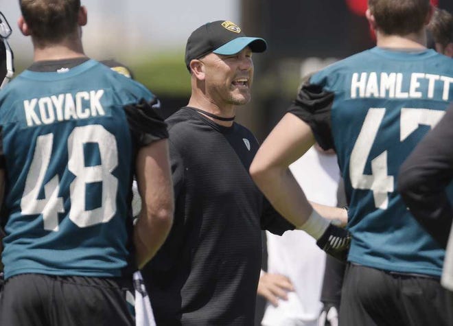 Bob.Self@jacksonville.com Jaguars head coach Gus Bradley talks to his players at the end of a June 8 OTA session at The Florida Blue Health and Wellness Practice Fields in Jacksonville. (The Florida Times-Union/Bob Self)