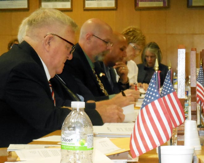 Herkimer County legislators discussed an introductory local law that would make the county attorney's position full-time during Wednesday's Legislature meeting. Shown in the foreground is Legislator Robert Hyde, R-Mohawk. GATEHOUSE NEW YORK PHOTO/DONNATHOMPSON