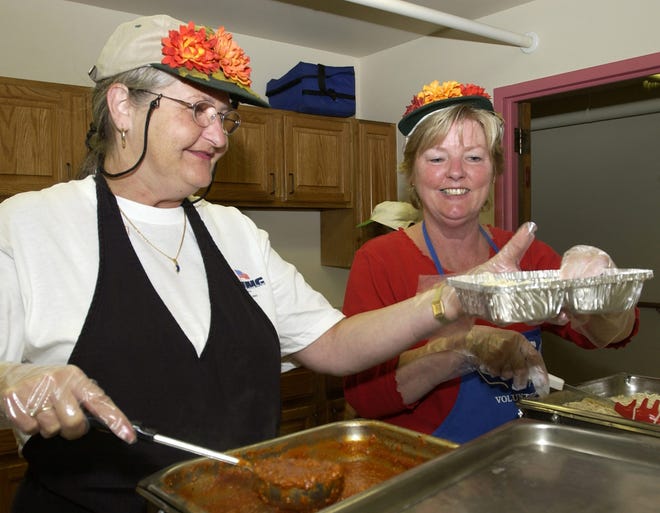 Courtesy photo
Volunteers help cook meals for the homeless.