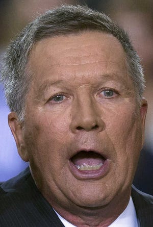 Ohio Gov. John Kasich announces he is running for the 2016 Republican party's nomination for president during a campaign rally at Ohio State University, Tuesday, July 21, 2015, in Columbus, Ohio. Kasich, a two-term governor and former congressman, has little name recognition in the crowded GOP field, but he is already airing television ads in New Hampshire where he is heading immediately after making his run official. (AP Photo/John Minchillo)