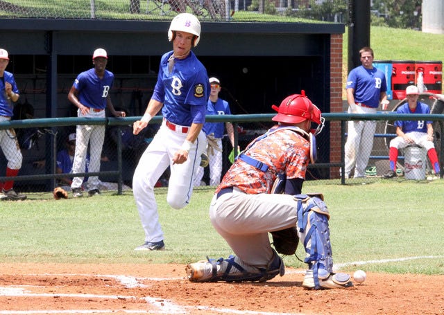 Jamie Mitchell • Times Record Sportsman catcher, Jake Herrel looses the ball at the plate, Saturday, July 25, 2015, as Blytheville's Chad Wright scores the second run during first inning play at Crowder Field.