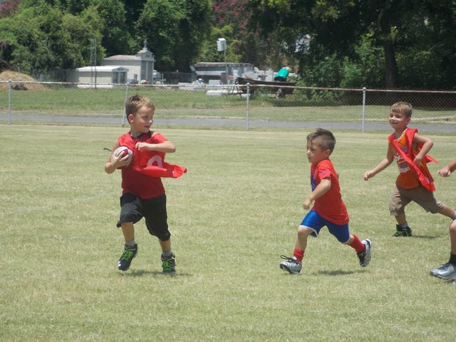 Young players from kindergarten to eighth grade participated in the Ascension Catholic Football Skills camp. Photo by Kyle Riviere.
