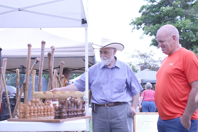 George Snyder points out some of his handmade specialties at the Farmers Market. Matthew Lounsberry photo