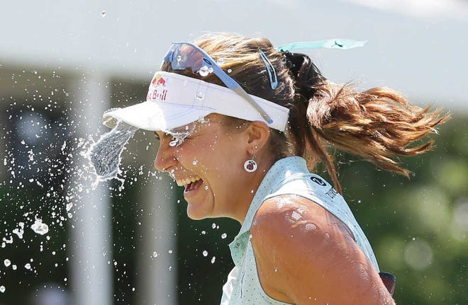 Lexi Thompson is doused with water after winning the Meijer LPGA Classic golf tournament Sunday, July 26, in Belmont, Mich.