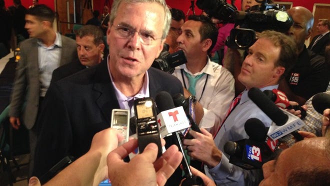 Republican presidential candidate and former Florida Gov. Jeb Bush talks with reporters Monday, July 27, 2015, after he spoke at a Central Florida pastors meet-and-greet at Centro Internacional de la Familia in Orlando. (Photo by GEORGE BENNETT)