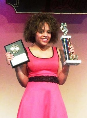Auburn High School freshman Chanel Black poses in March 2015 with the Judge's Award and Audience Choice Award from the school's Auburn's Got Talent competition.

PHOTO PROVIDED