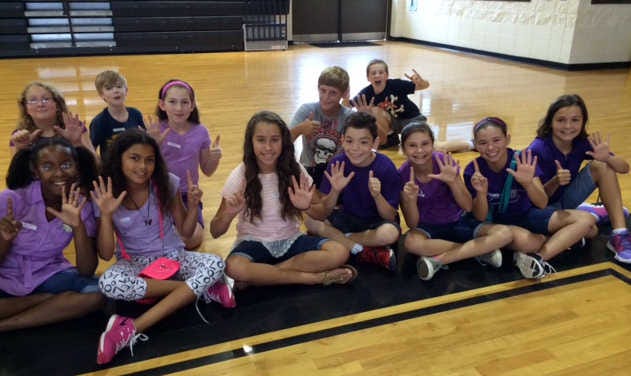 Courtesy of Elizabeth Bennett Students at the RHMS bootcamp raise six fingers indicating their grade level for the 2015-2016 school year.