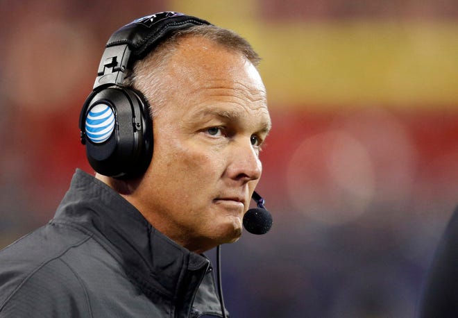 In this Dec. 20, 2014, file photo, Georgia coach Mark Richt watches the first half of the Belk Bowl NCAA college football game against Louisville in Charlotte, N.C.