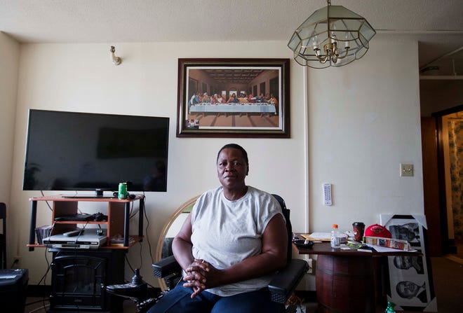 Sharon Bridges sits in her apartment at the Friendship Tower apartments Monday, July 20, 2015, in Atlanta. Residents have pleaded with Friendship Baptist Church, which owns the building, to fix what tenants say is a broken air conditioning system. "It has been really rough," said Bridges, part of a lawsuit filed against the church and management company. "I know if I don't stand up for myself, no one else is." A project manager vowed Monday to make air conditioning upgrades at the building for low-income residents who say temperatures regularly soar to dangerous levels inside. (AP Photo/David Goldman)