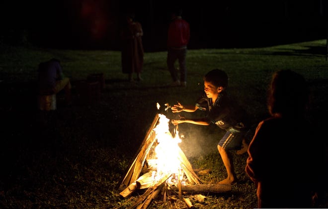 Sitting around a campfire can be better than watching TV.

AP
