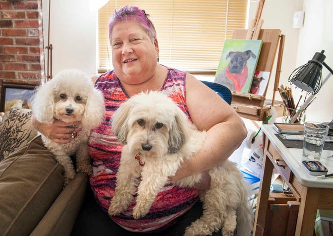 Linda Henson has owned dogs all her life, including Sparky, left, Bichon Fise, and Pete, right, a Havanese, both 8 years old. Henson says normally she goes to the Helping Hands Humane Society to adopt a dog, but needed dogs that were hypoallergenic the last time she was looking to adopt.