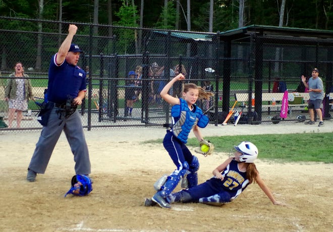 Ellie Dicarlo of Hanover Blue pumps her fist as the the umpire does after tagging out Katie North of Hanover Gold at home plate. Gold had been leading Blue most of the game until a late surge got the lead for Gold in this town playoff softball game. Gold was threatening Blue's 8-6 lead until this play stopped the threat in its tracks.



Wicked Local photo/Mark Jarret Chavous
