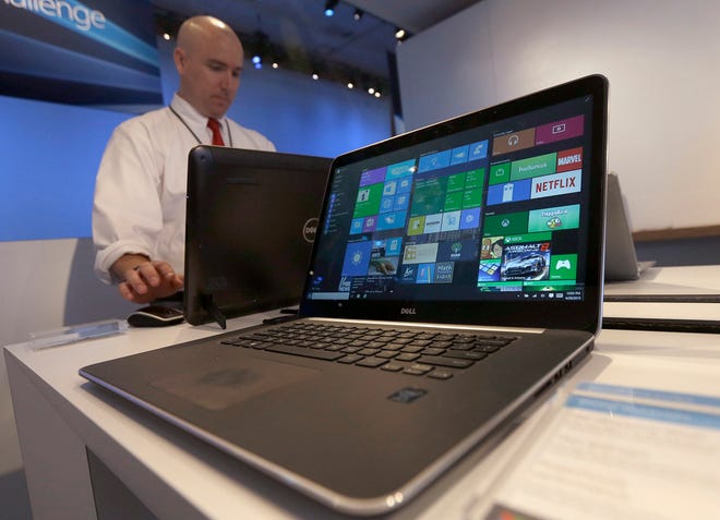 In this April 29, 2015 file photo, a Dell laptop computer running Windows 10 is on display at the Microsoft Build conference in San Francisco. Microsoft's new Windows 10 operating system debuts Wednesday, July 29, 2015, as the longtime leader in PC software struggles to carve out a new role in a world where people increasingly rely on smartphones, tablets and information stored online. (AP Photo/Jeff Chiu, File)