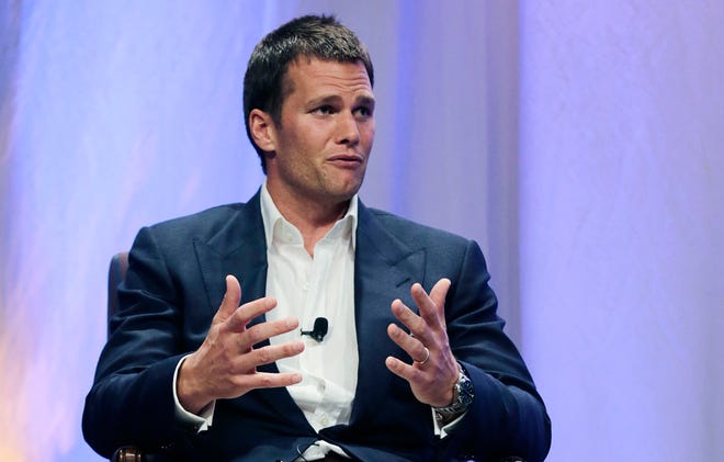 In this May 7, 2015, file photo, New England Patriots quarterback Tom Brady gestures during an event at Salem State University in Salem, Mass. Brady's four-game suspension for his role in using underinflated footballs during the AFC championship game last season has been upheld by NFL Commissioner Roger Goodell. The league announced the decision Tuesday, July 28, 2015. (AP Photo/Charles Krupa, Pool)