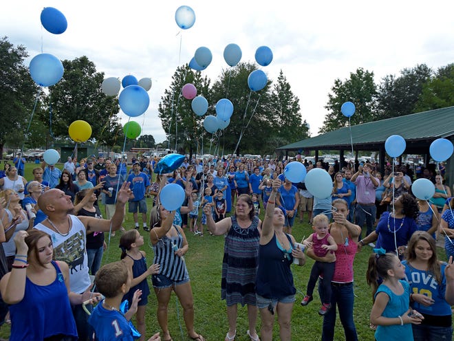 Participants in Wednesday evening's vigil for Lonzie Barton release balloons at the end of the gathering in Macclenny. Several hundred Baker County residents, friends and family members of missing Jacksonville toddler Lonzie Barton gathered at Duck Pond Park in Macclenny, Florida Wednesday evening, July 29, 2015 for a vigil. The group gathered to offer prayers and words of support in the continued search for the 21-month-old boy who went missing last week.