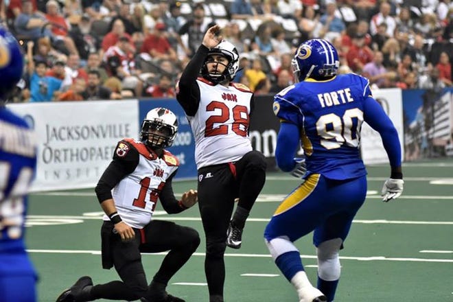 Former Ashbrook standout Julian Rauch kicks an extra point during last Satiurday's 63-16 victory for Rauch and the Jacksonville Sharks over the Tampa Bay Storm in the Arena Football League.