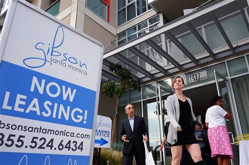 In this Wednesday, March 18, 2015 photo, visitors arrive for the grand opening of Gibson Santa Monica, a new luxury apartment complex in downtown Santa Monica, Calif. Residential rents, the biggest driver of inflation in 2015, climbed 3.5 percent in June from a year earlier, the fifth straight month with an annual gain of that size.