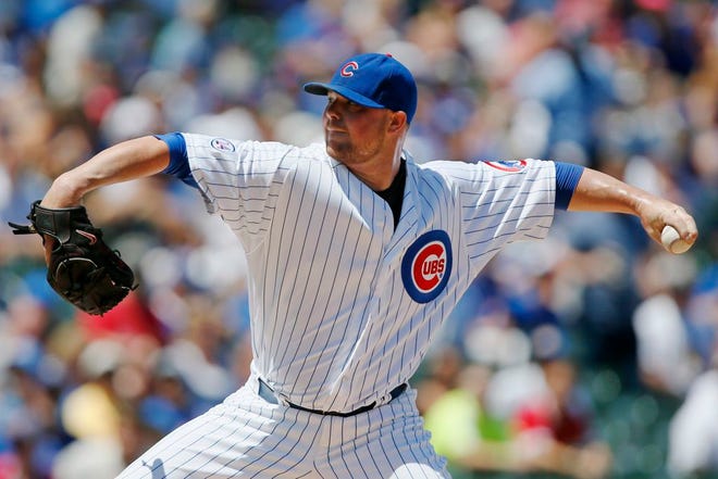 Chicago Cubs starting pitcher Jon Lester throws against the Colorado Rockies during the first inning of a baseball game in Chicago, Wednesday, July 29, 2015.