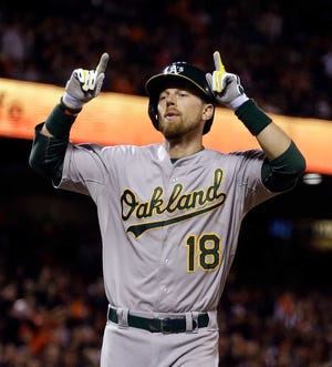 Oakland Athletics' Ben Zobrist celebrates after hitting a home run against the San Francisco Giants in the seventh inning of a baseball game, Friday, July 24, 2015, in San Francisco. (AP Photo/Ben Margot)